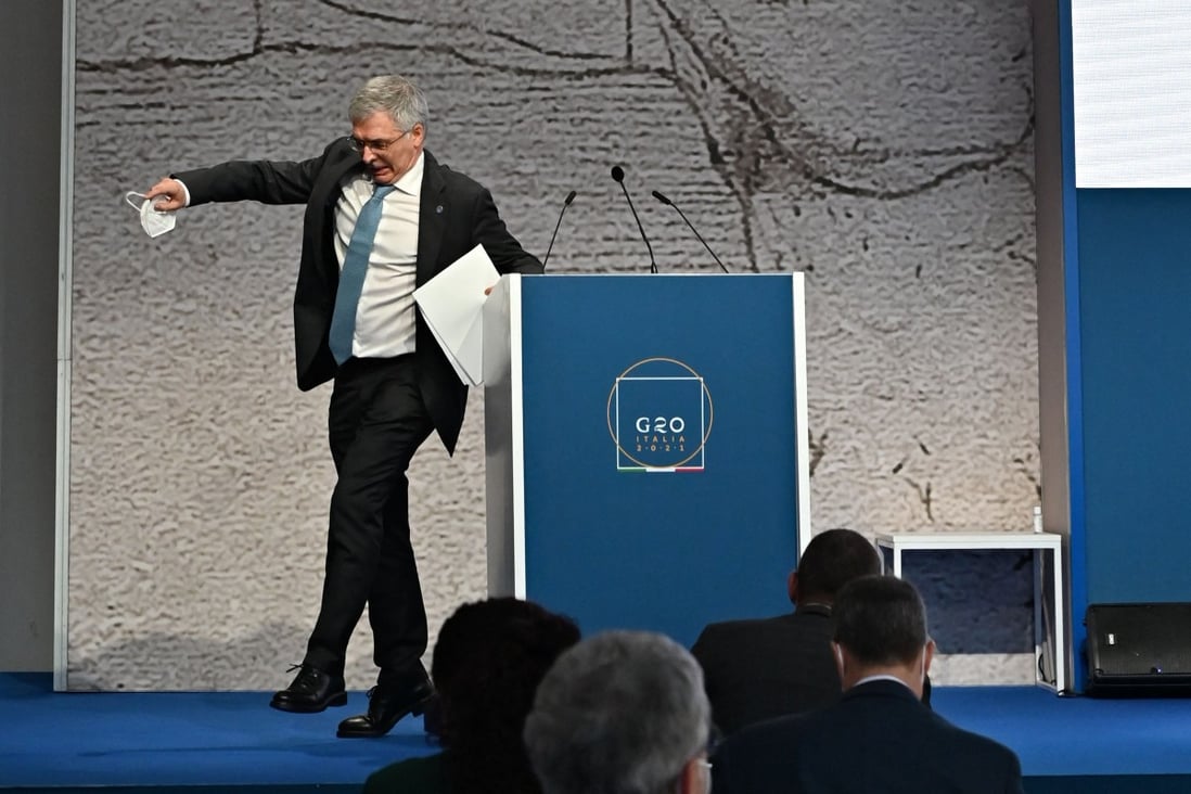 Daniele Franco, Italy's Minister of Economy and Finance, stumbles after his speech during a press conference on Friday at the G20 finance ministers and central bankers meeting in Venice. Global tax reform is at the top of the agenda as the world's biggest economies seek to ensure multinational companies pay their fair share. Photo: AFP