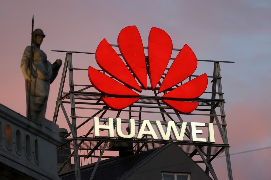 The logo of the Chinese telecommunications giant Huawei Technologies is pictured next to a statue on top of a building in Copenhagen, Denmark, on June 23, 2021. Photo: Reuters