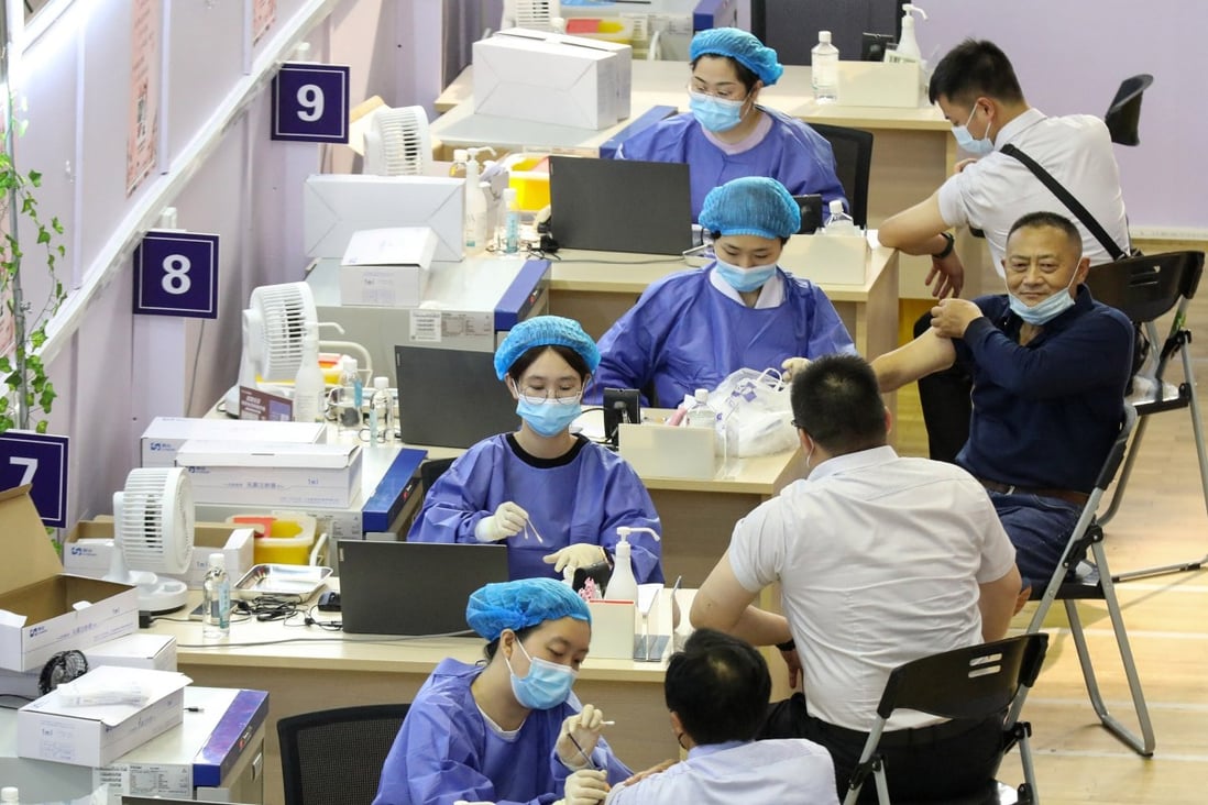 People get vaccinated in Nantong, Jiangsu province last week. China wants 70 per cent of the population immunised by the end of the year. Photo: AFP