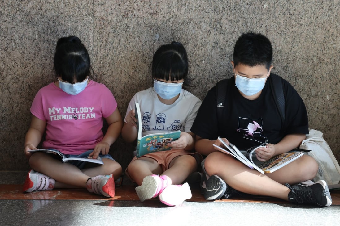 Youngsters get stuck into books on the second day of Hong Kong Book Fair, on July 15. Photo: Nora Tam