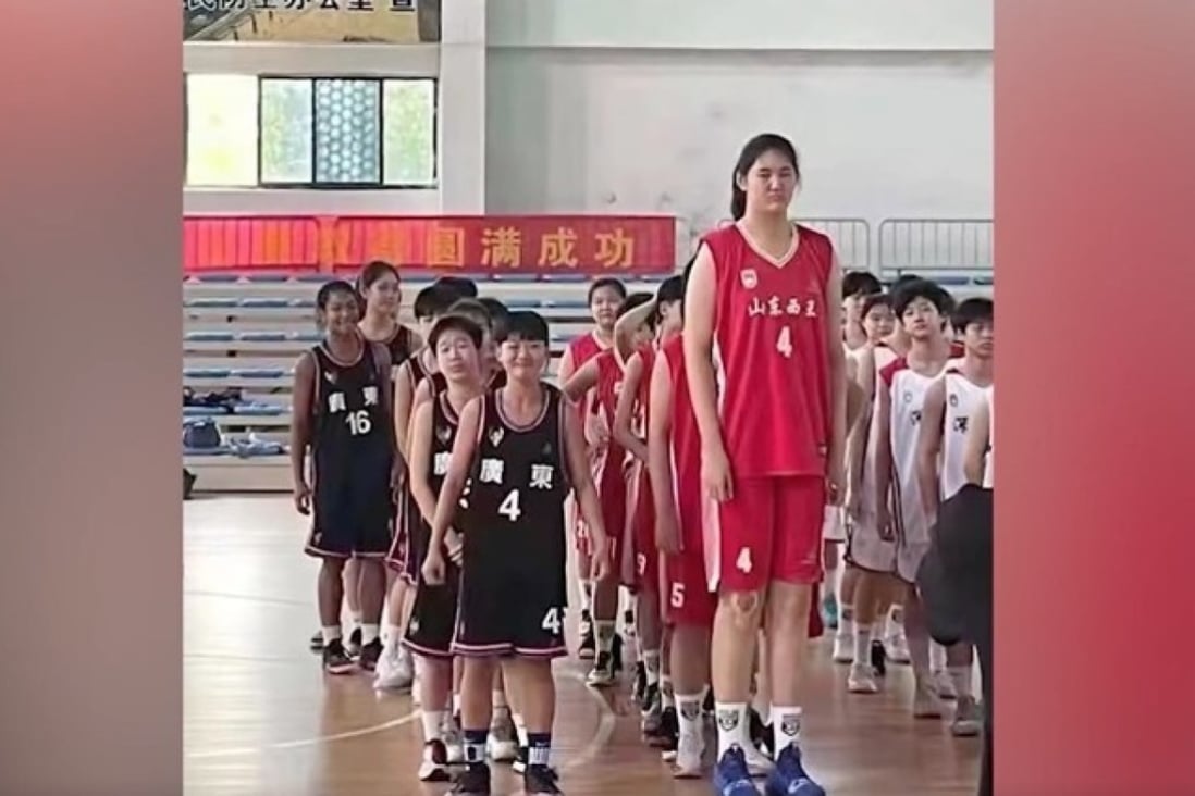 A screenshot showing Zhang Ziyu lining up with her teammates and opponents at a basketball tournament in Jingzhou, Hubei province. Photo: Weibo