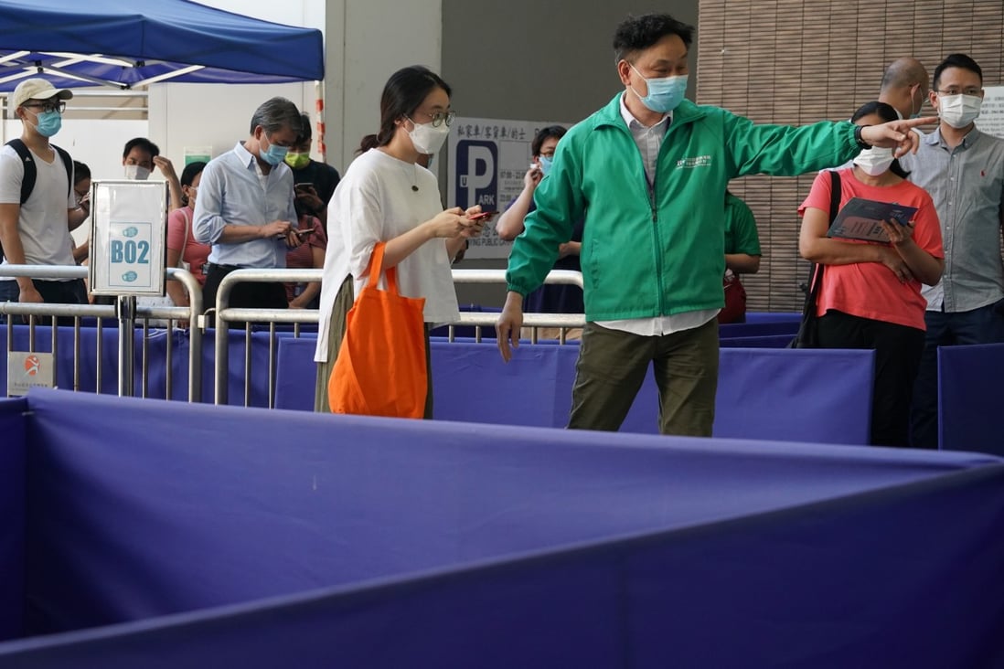 People arrive for their BioNTech vaccination appointments at Sun Yat Sen Memorial Park Sports Centre on Thursday. Photo: Felix Wong