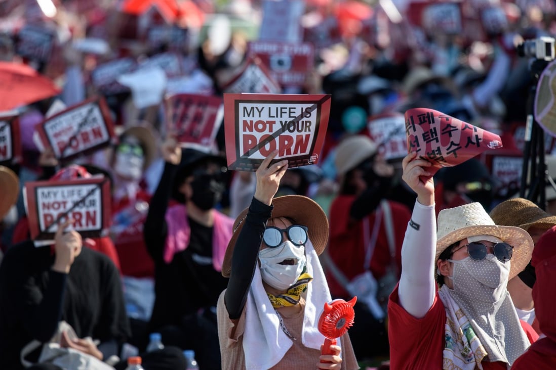 Protesters shout slogans during a 2018 rally against non-consensual “spy-cam porn” in Seoul, South Korea. Photo: AFP