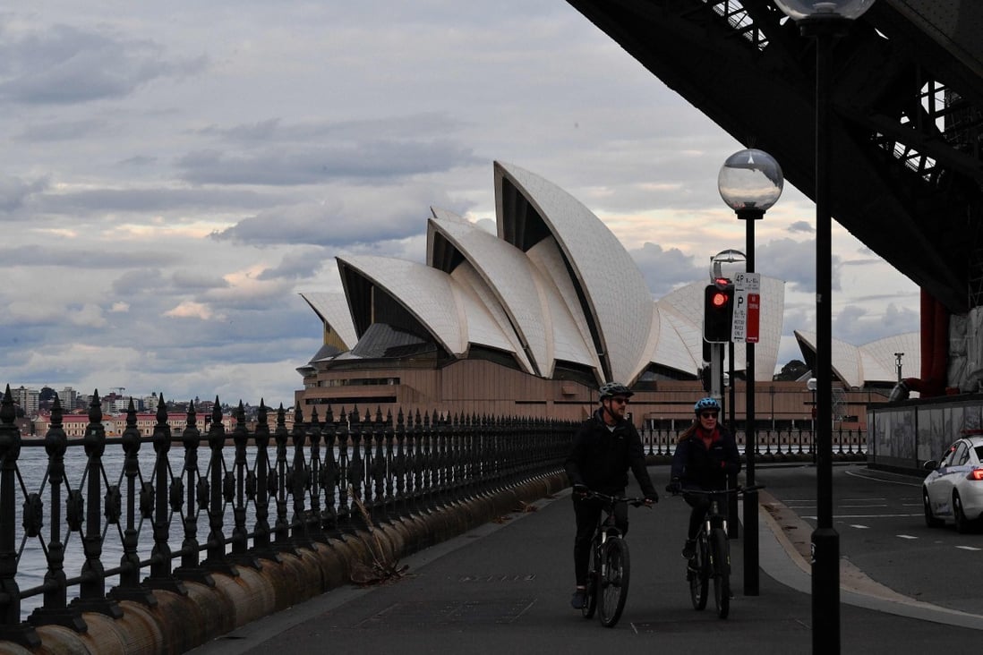 A mostly quiet walkway under the Sydney Harbour Bridge amid a lockdown as cases surge in the state. Photo: AFP