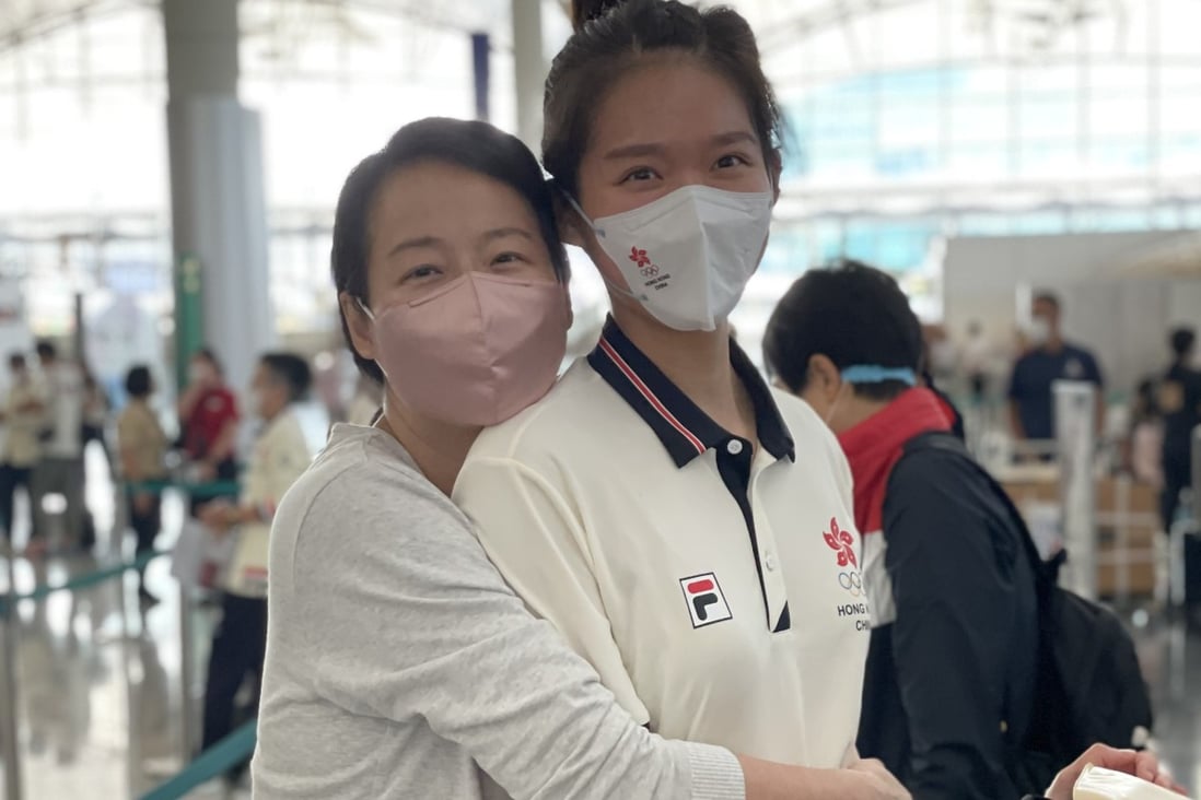 Medal hopeful Vivian Kong is hugged by her mother at the airport before leaving for the Tokyo Olympics. Photo: Chan Kin-wa