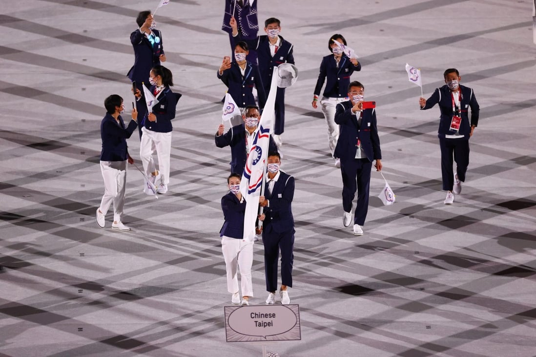 The Taiwanese team led by flag bearers Lu Yen-hsun and Kuo Hsing-Chun enter the Olympic Stadium in Tokyo during the opening ceremony. Photo: Reuters