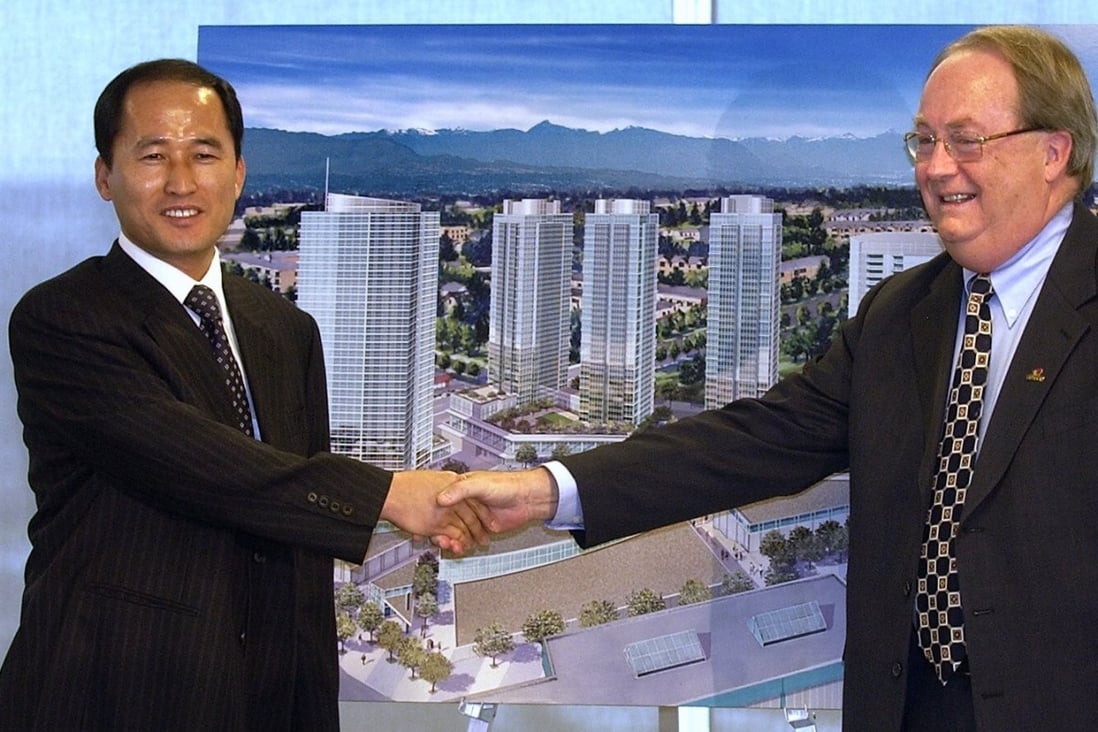 South Korean developer Jung Myung-soo is seen at the unveiling of his plans for the Central City project in Surrey, British Columbia, in 2005, with Surrey Mayor Doug McCallum. At the time it was to be the biggest residential and retail development in Surrey's history. Photo: Material republished with the express permission of Vancouver Province, a division of Postmedia Network Inc