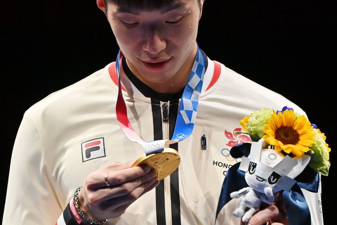 Hong Kong's Cheung Ka Long looks his gold medal for the men's individual foil during the Tokyo 2020 Olympic Games, on July 26, 2021. Photo: AFP