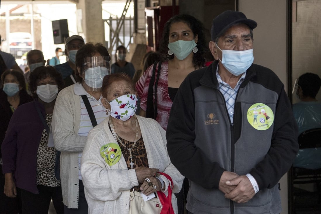 Chileans queue for the CoronaVac vaccine in the capital Santiago. Photo: AFP