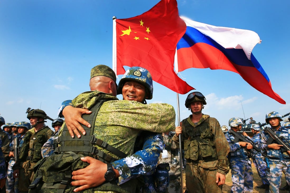 Chinese and Russian marines hug during a joint naval drill in China's Guangdong province in 2016. The two nations say their troops will stage an exercise together in Ningxia in August. Photo: Xinhua