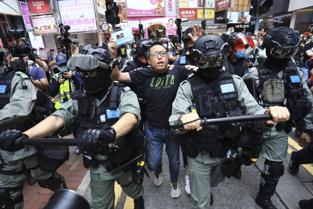 People Power activist Tam Tak-chi (centre) near the Sogo department store in Causeway Bay on May 24 last year. Photo: May Tse
