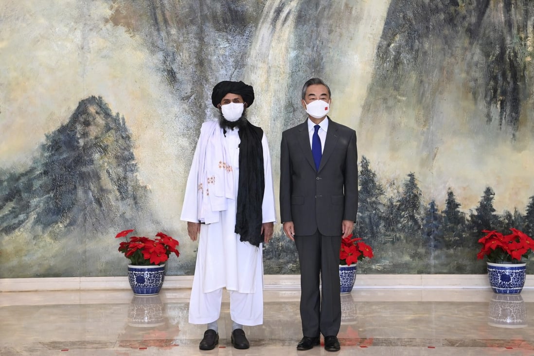 Taliban co-founder Mullah Abdul Ghani Baradar (left) and Chinese Foreign Minister Wang Yi hold talks in Tianjin on Wednesday. Photo: Xinhua via AP