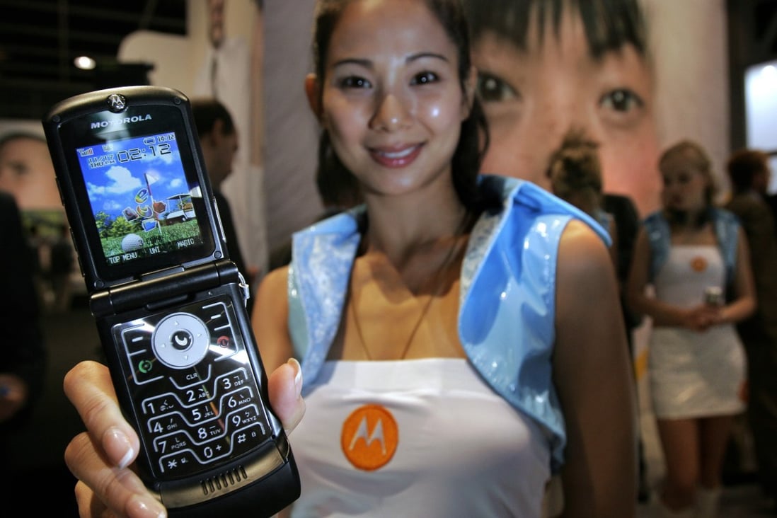 A Motorola Razr V3c mobile phone that features a glass screen made by Biel Crystal, at the 3G World Congress & Exhibition 2005 at Hong Kong Convention and Exhibition Centre on 17 November 2005. Photo: SCMP