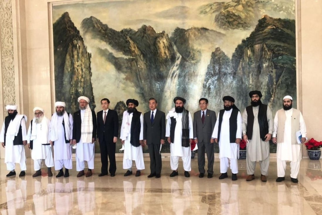 The Taliban delegation with Chinese Foreign Minister Wang Yi in Tianjin. Photo: Handout