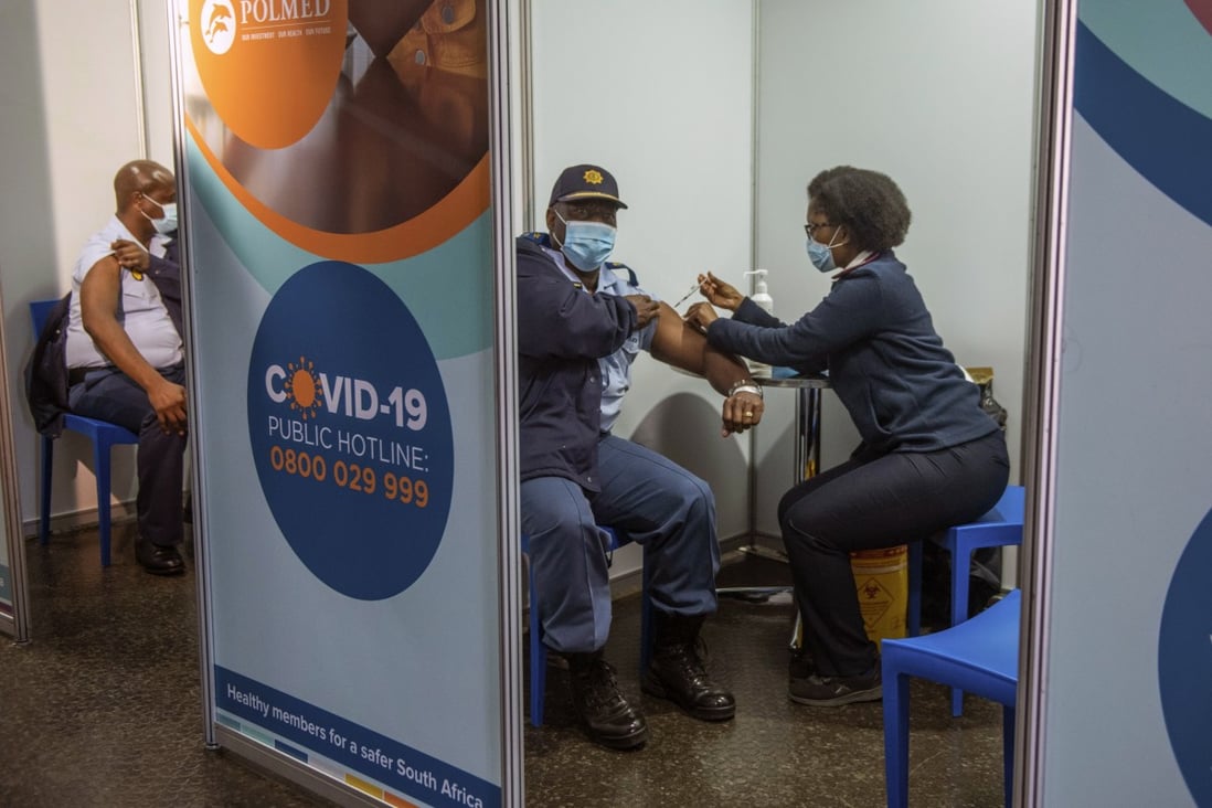 A police officer receives a Johnson & Johnson Covid-19 vaccine in Soweto, South Africa. There has been a rapid rise in infections across the continent, and experts say the surge here has not yet peaked. Photo: AP Photo