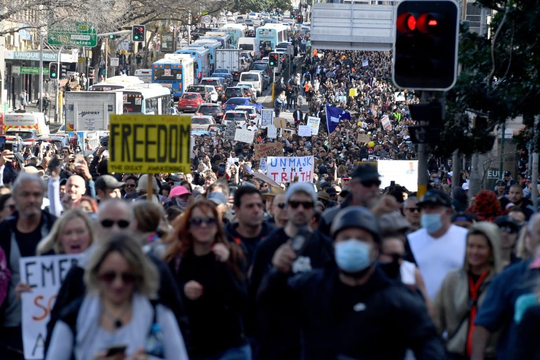 Protesters march during an anti-lockdown rally in Sydney on July 24. Photo: AAP Image via DPA