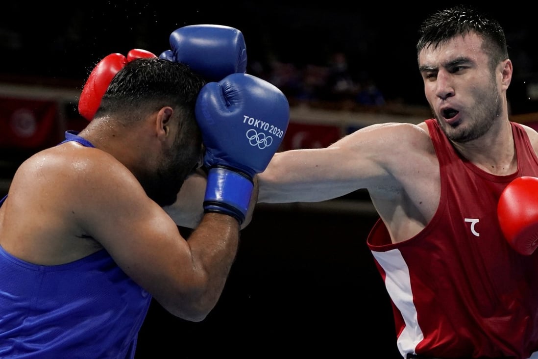 Bakhodir Jalolov of Uzbekistan in a Tokyo 2020 Olympic Games men’s super heavyweight fight against Satish Kumar of India. Photo: Reuters