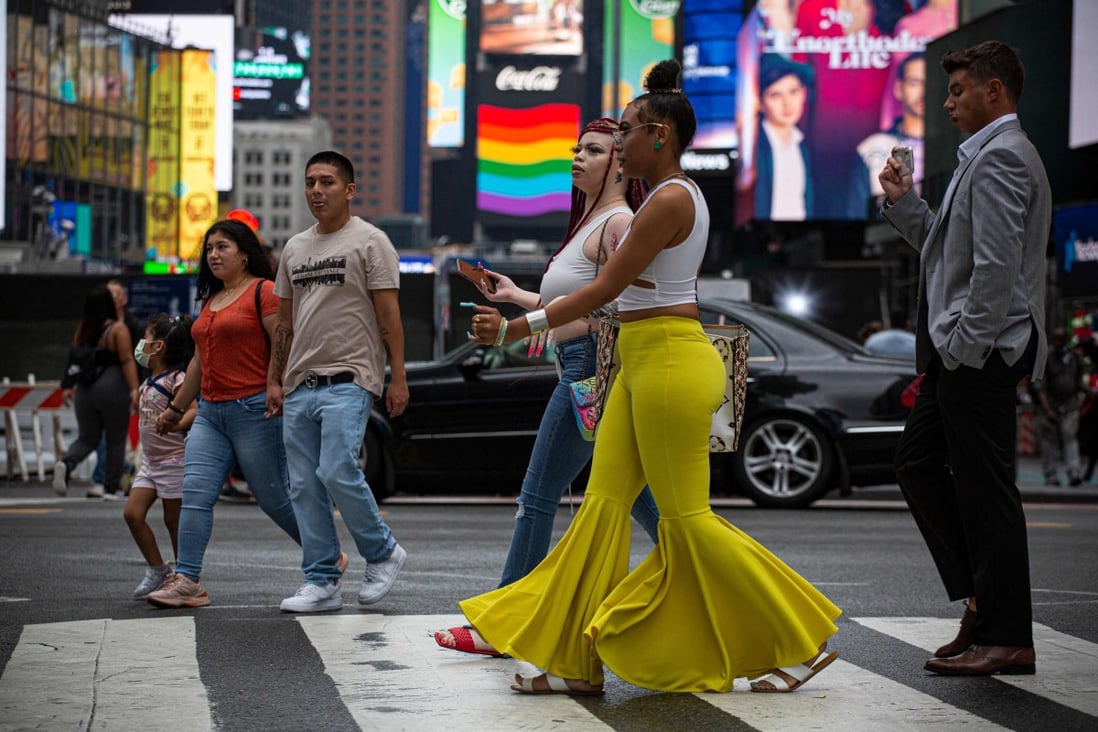 Unmasked people walked through the street in Midtown Manhattan in New York in July 2021. A report by three Chinese think tanks accuses the US of being the country with the worst pandemic management record in the world. Photo: AFP