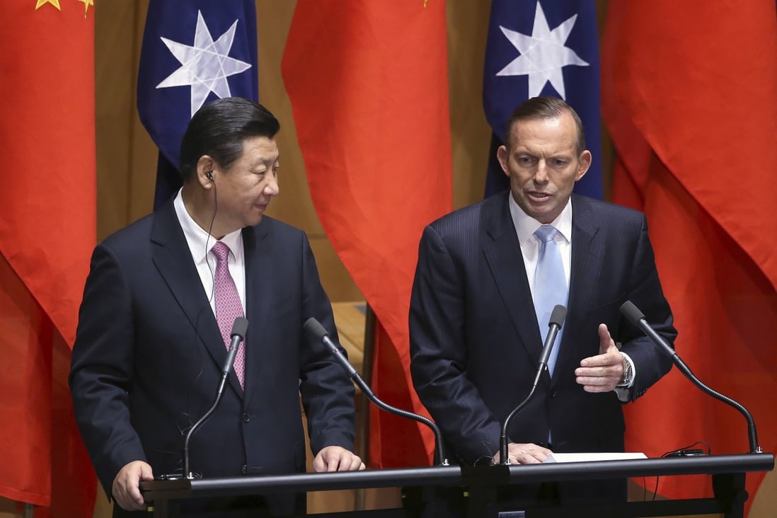 Australia’s former prime minister, Tony Abbott, is seen here in Canberra with President Xi Jinping in November 2014. Photo: AP