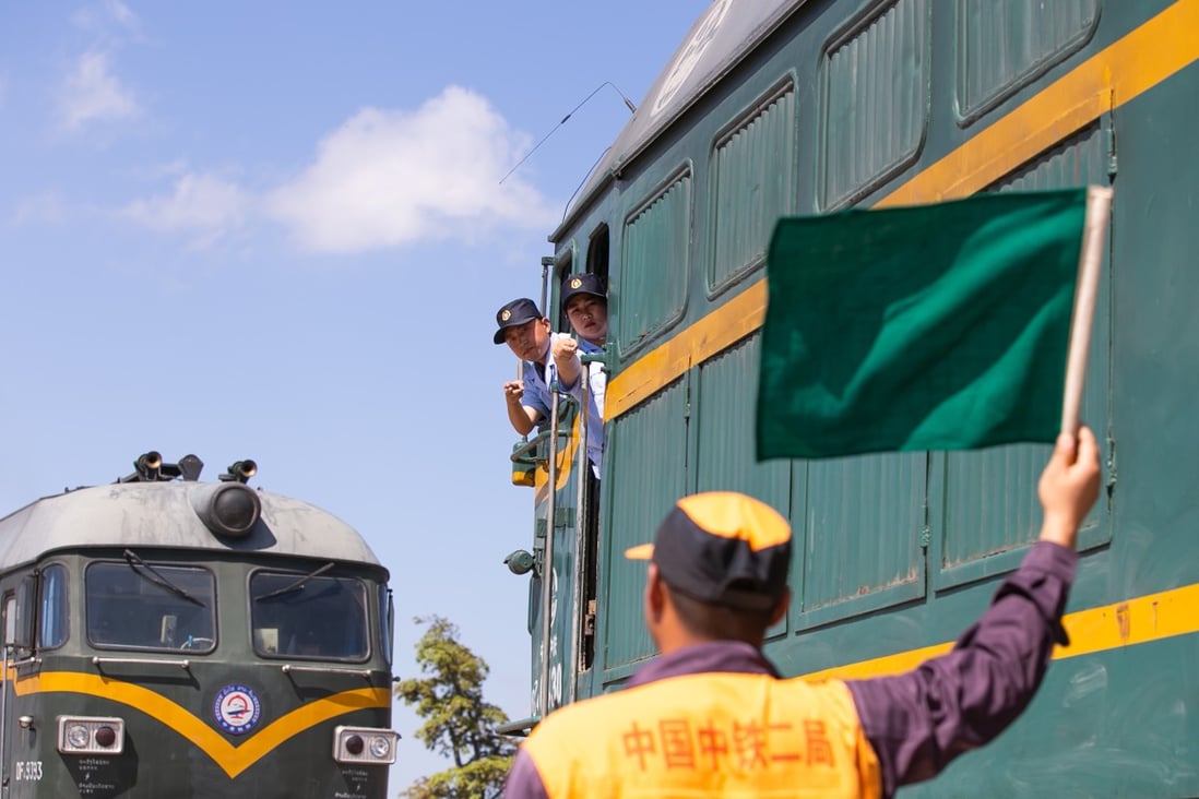 A trainee in Laos learns train signals from a Chinese mentor on the northern outskirts of Vientiane ahead of the opening of the China-Laos railway. Photo: Xinhua