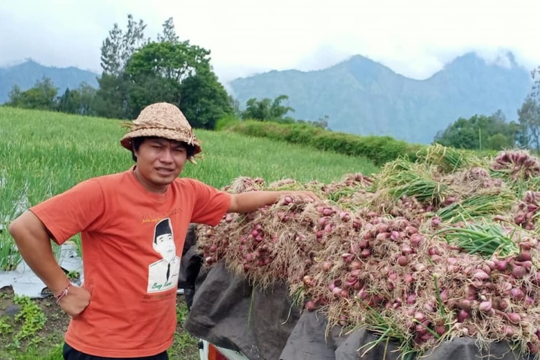 Sukarsana with his crop of shallots. Photo: Sukarsana