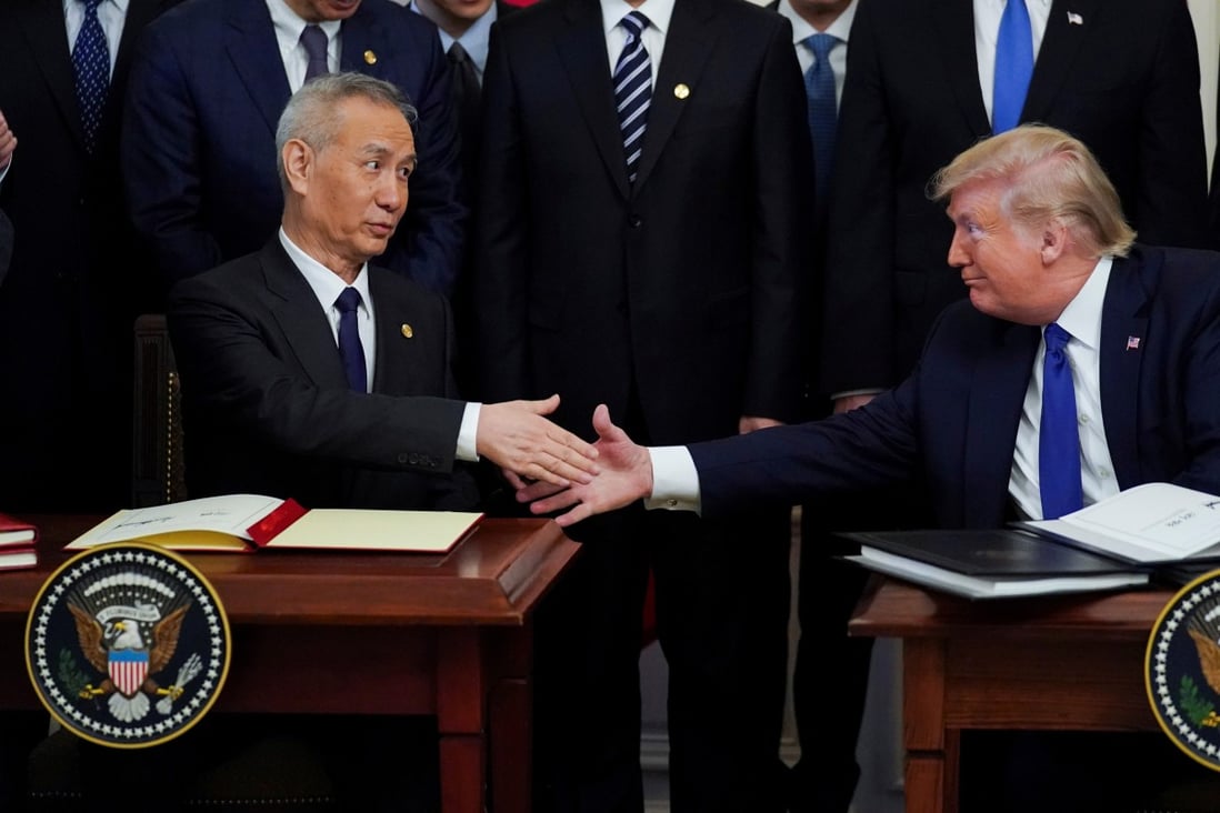 Chinese Vice-Premier Liu He and then US president Donald Trump sign the phase one trade deal in January 2020. Photo: Reuters