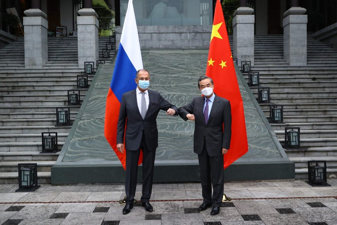 Foreign ministers Sergey Lavrov of Russia (left) and Wang Yi of China meet in the Chinese city of Guilin on March 22. In a phone call on Monday, the top diplomats pledged to work together to protect national interests in Afghanistan. Photo: AFP