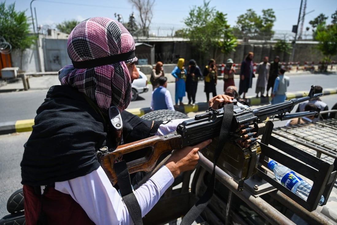 A Taliban fighter mans a machine gun during a patrol along a Kabul street on Monday, after a stunningly swift end to Afghanistan’s 20-year war. Photo: AFP