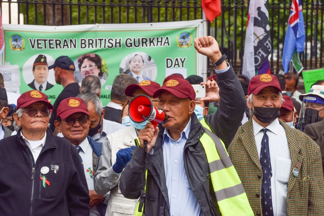 A Gurkha veteran speaks through a megaphone during a protest outside 10 Downing Street. Photo: Handout