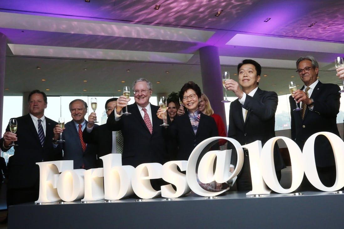 Steve Forbes (centre), chairman and editor-in-chief of Forbes Media, and Hong Kong Chief Executive Carrie Lam Cheng Yuet-ngor, at the Forbes@100 Light-up Ceremony at InterContinental Hong Kong in 2017. Photo: Jonathan Wong