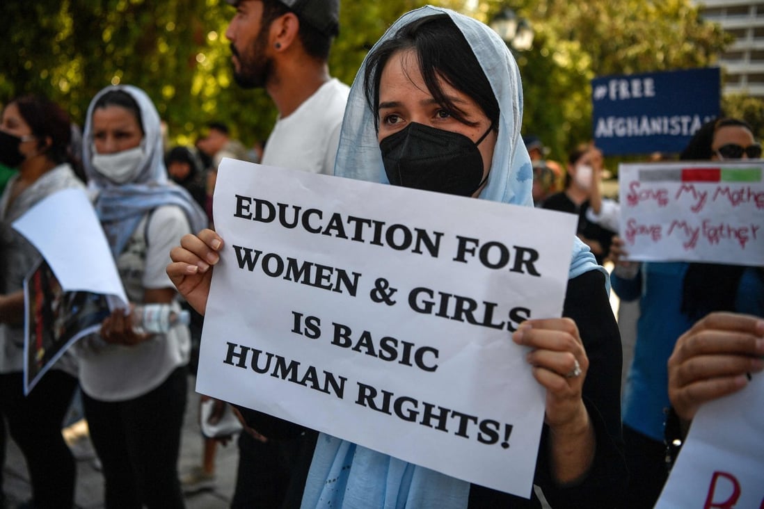 A protester holds a placard calling for education for Afghan women during a demonstration outside the US embassy in Athens, Greece on Saturday. Photo: AFP