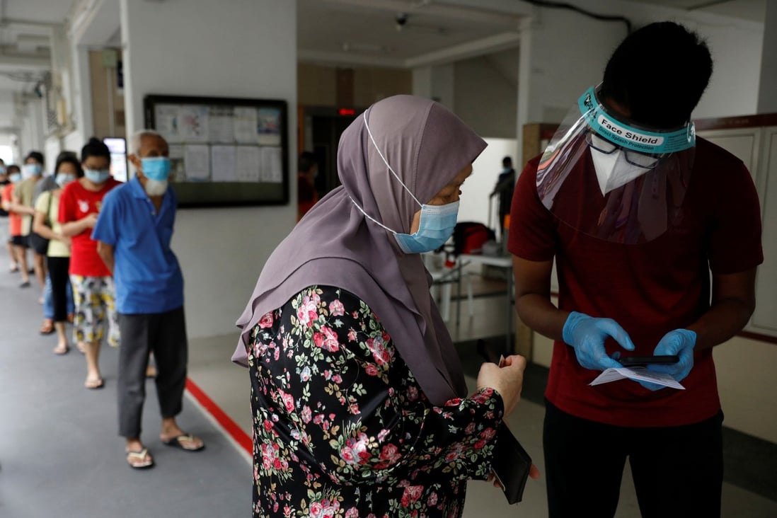 Residents queue up for Covid-19 swab tests in Singapore. File photo: Reuters