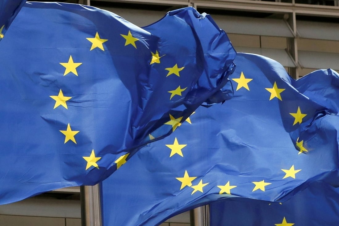 European Union flags outside the EU Commission headquarters in Brussels, Belgium. Photo: Reuters
