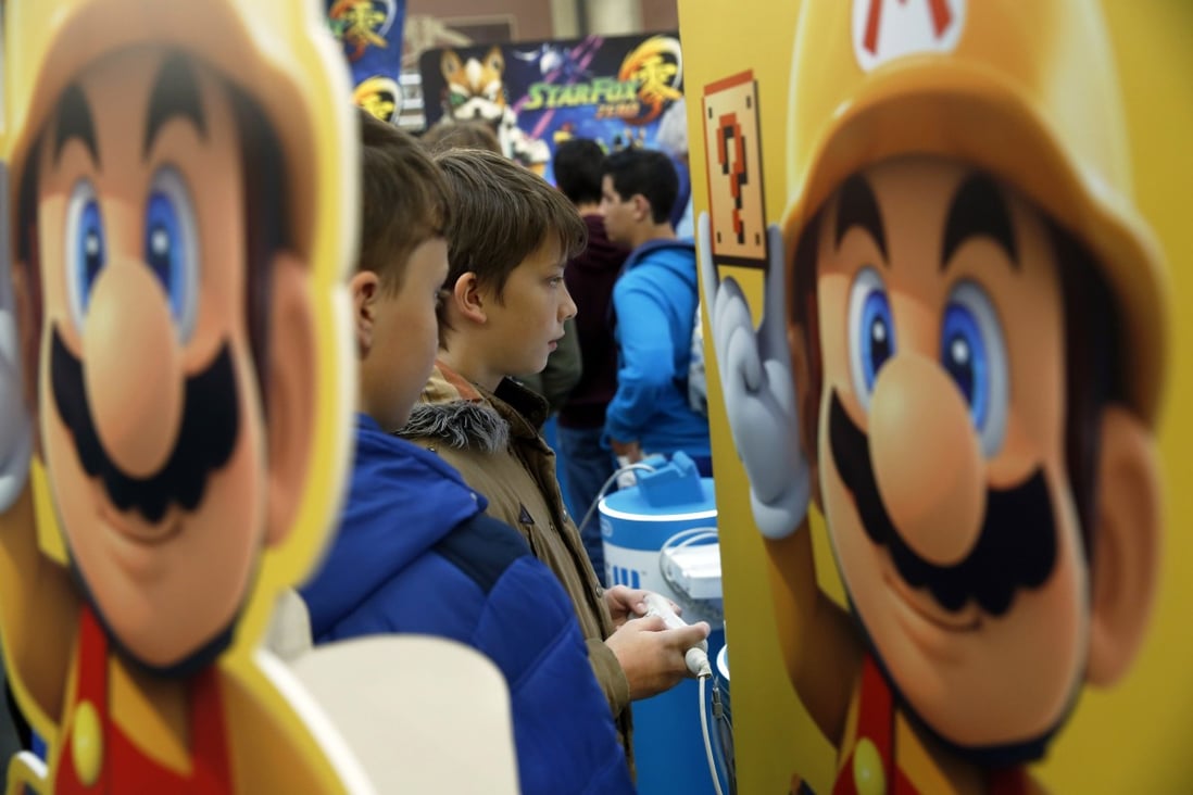 Mario, a character from Nintendo’s Mario franchise, next to young players at the Legends of Gaming Live event in London on 15 September 2015. Photo: Bloomberg