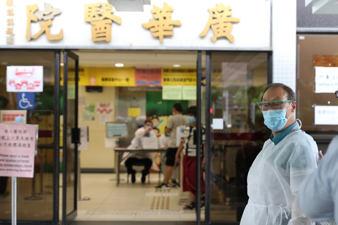 Medical workers are seen outside Kwong Wah Hospital in Yau Ma Tei. Photo: Nora Tam