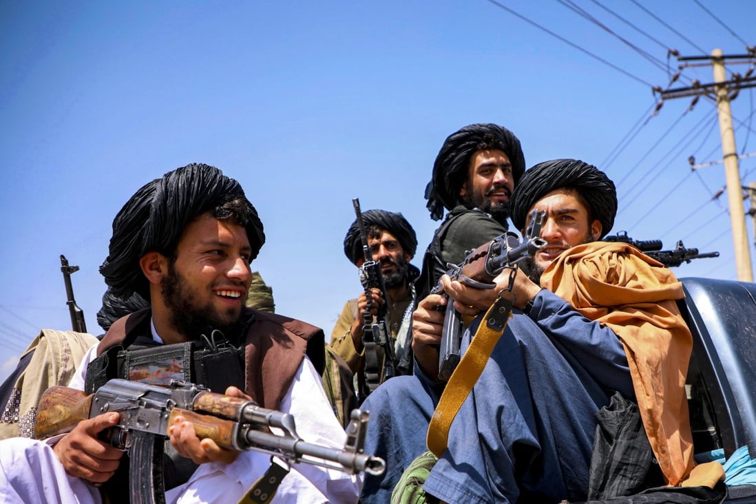 Taliban forces patrol in front of the airport in Kabul, Afghanistan, on Thursday. The situation has moved many in Hong Kong to raise funds for refugees and others affected by the crisis. Photo: Reuters