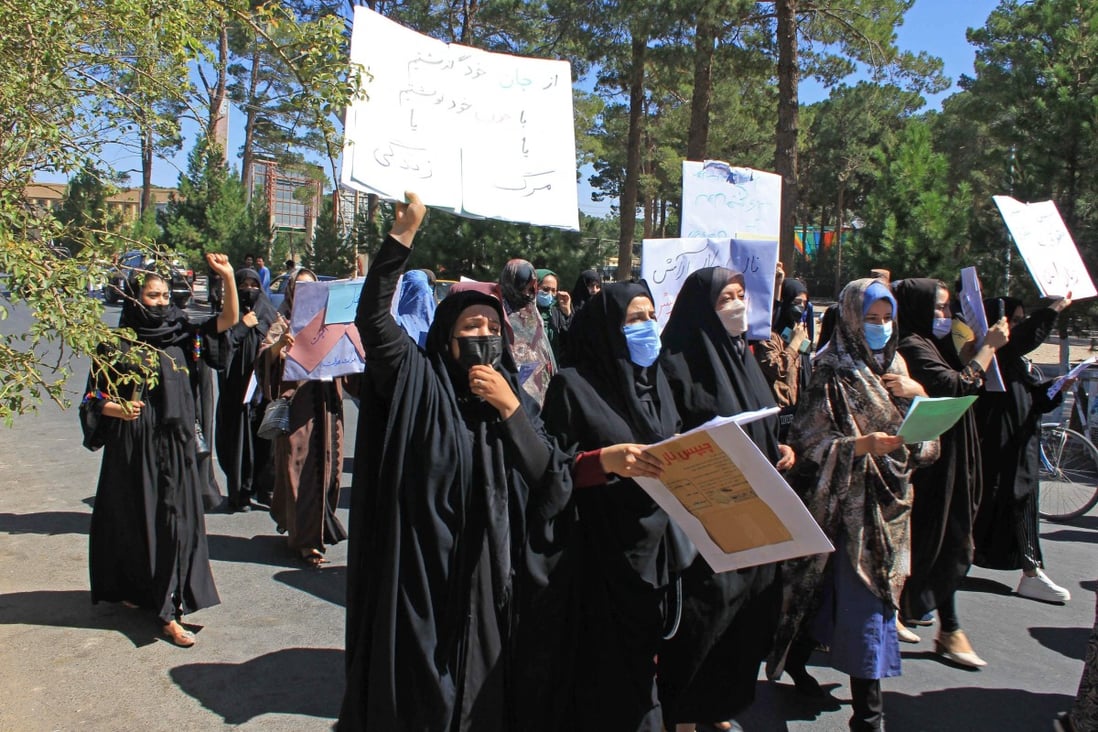 Afghan women holding placards at a protest in Herat this month. Photo: AFP