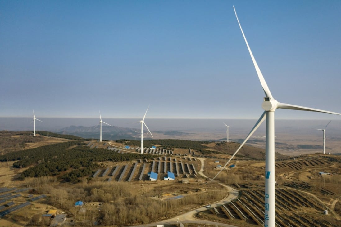 Wind turbines and solar panels near Fuxin, Liaoning province, China. Photo: Bloomberg