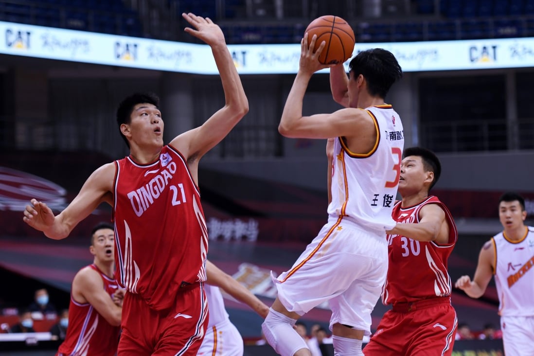 Liu Chuanxing (No 21) of the Qingdao Double Star Eagles in action against the Bayi Rockets during the 2019-2020 Chinese Basketball Association. Photo: Xinhua