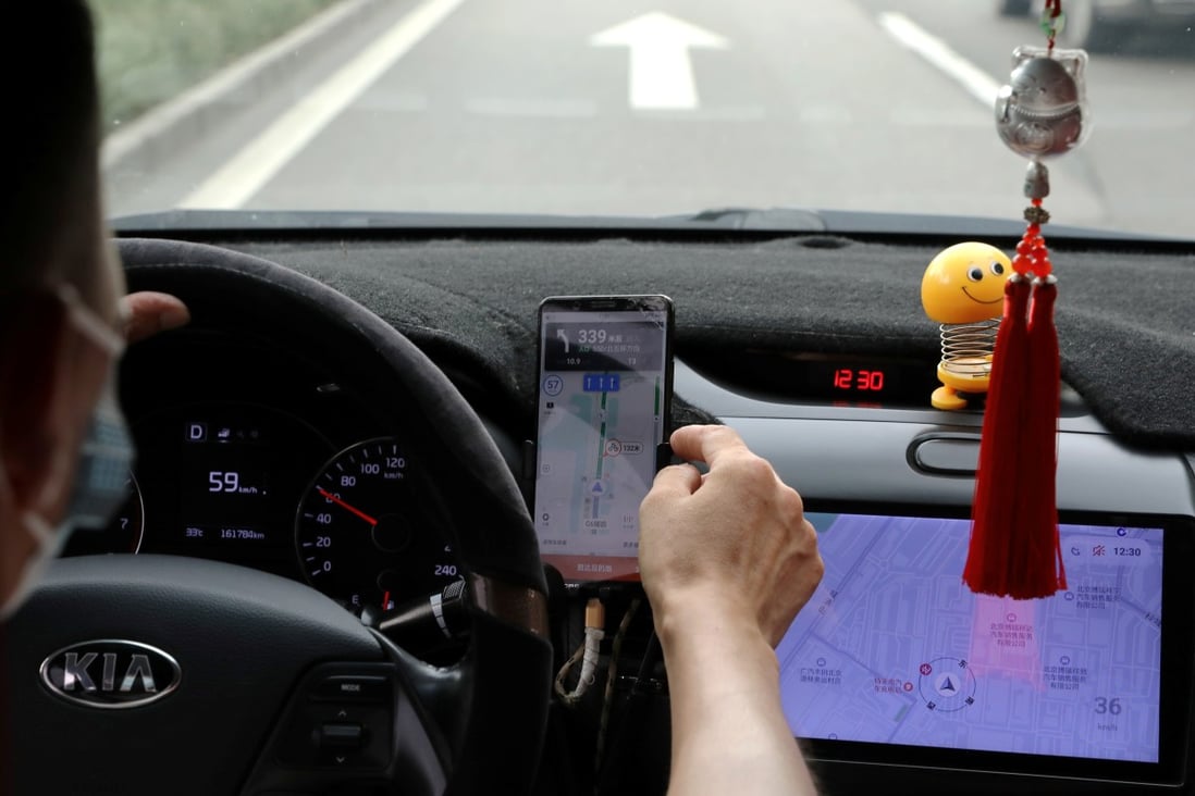 A driver of Chinese ride-hailing service Didi in Beijing, China on July 5, 2021. Photo: Reuters