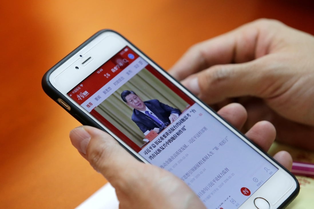 A Communist Party member accessing the smartphone app Xuexi Qiangguo, which literally translates to 'Study to make China strong,' for distributing propaganda to the party faithful in Beijing on February 25, 2019. Photo: Reuters