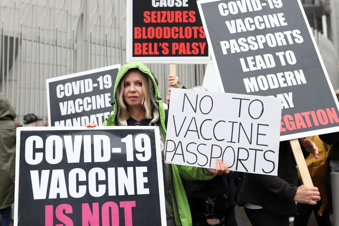 Anti-vaccine protesters hold placards as they take part in a protest against Covid-19 vaccinations in Britain earlier this month. Photo: Reuters