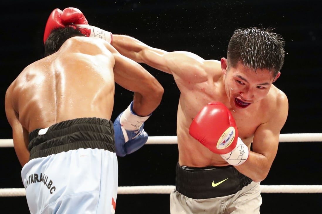 Hong Kong's Raymond Poon Kai-ching (right) fights Indonesia's Frengky Rohi in the Clash of Champions 3 at the Hong Kong Convention and Exhibition Centre in Wan Chai in 2017. Photo: SCMP / Edward Wong