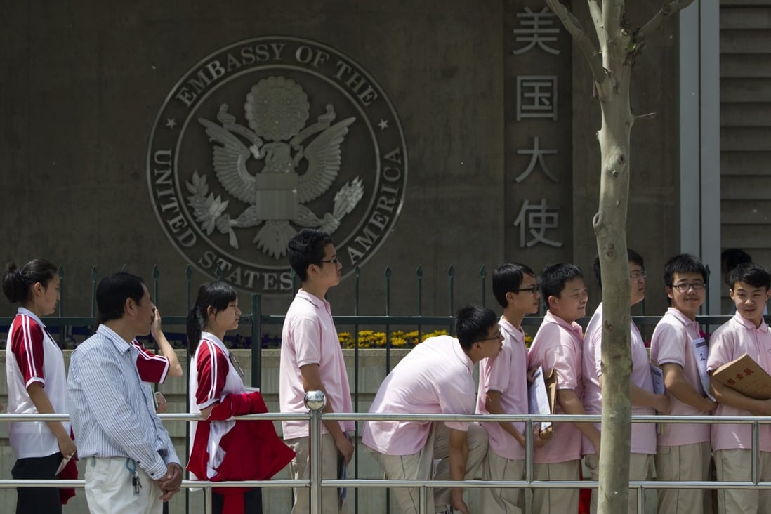 Chinese students wait outside the US Embassy in Beijing for visa application interviews. Photo: AP