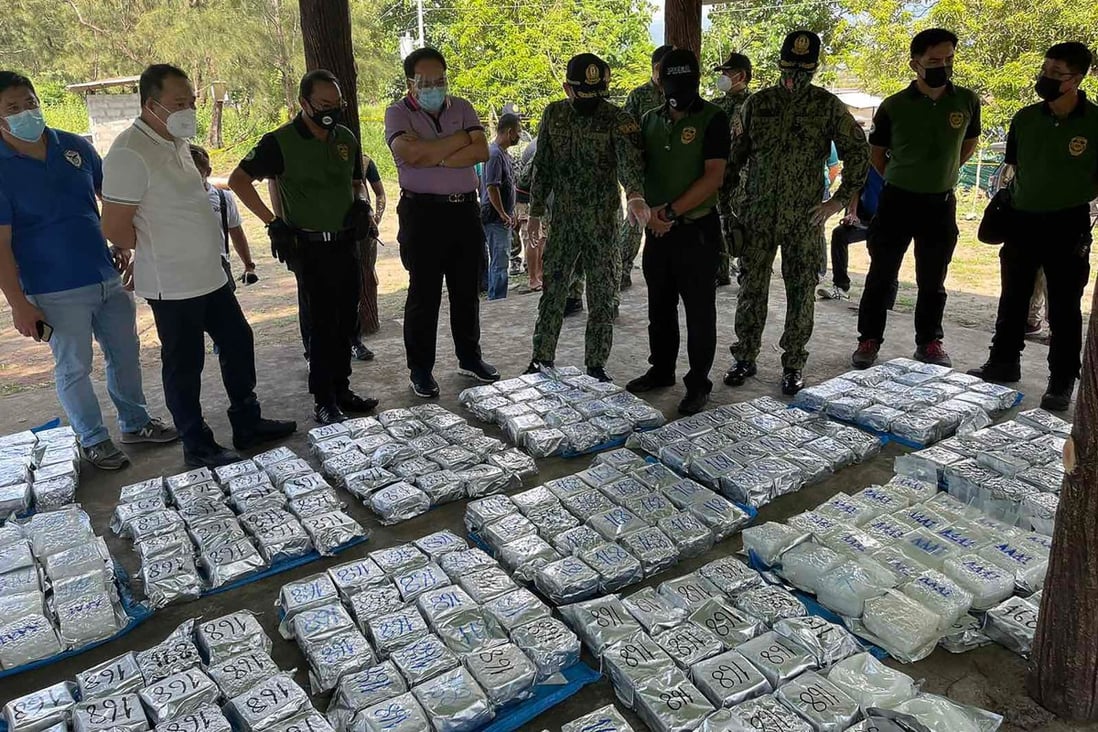 Police and Philippine Drug Enforcement Agency officials inspect seized narcotics after a drugs bust. Photo: Philippine National Police-Public Information Office via AFP