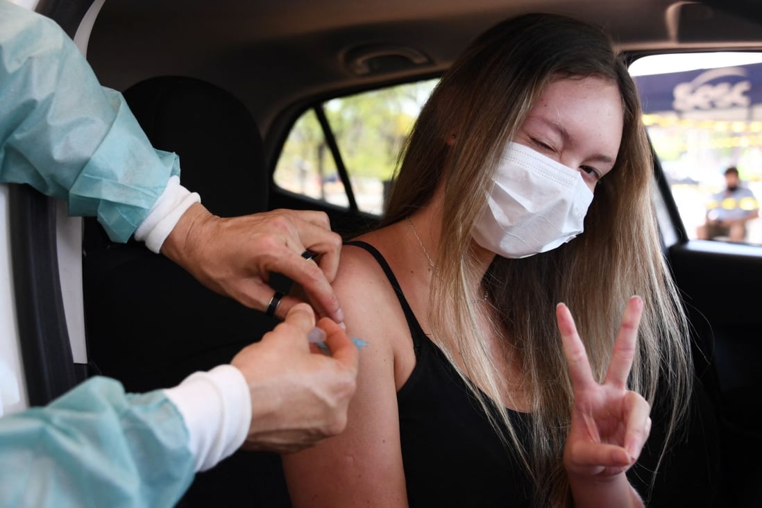 A woman receives a jab of the CoronaVac vaccine in Brasilia. Photo: AFP