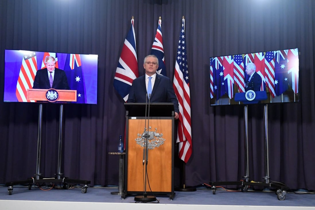 Australian Prime Minister Scott Morrison (centre), flanked by Britain’s Prime Minister Boris Johnson and US President Joe Biden. Photo: EPA