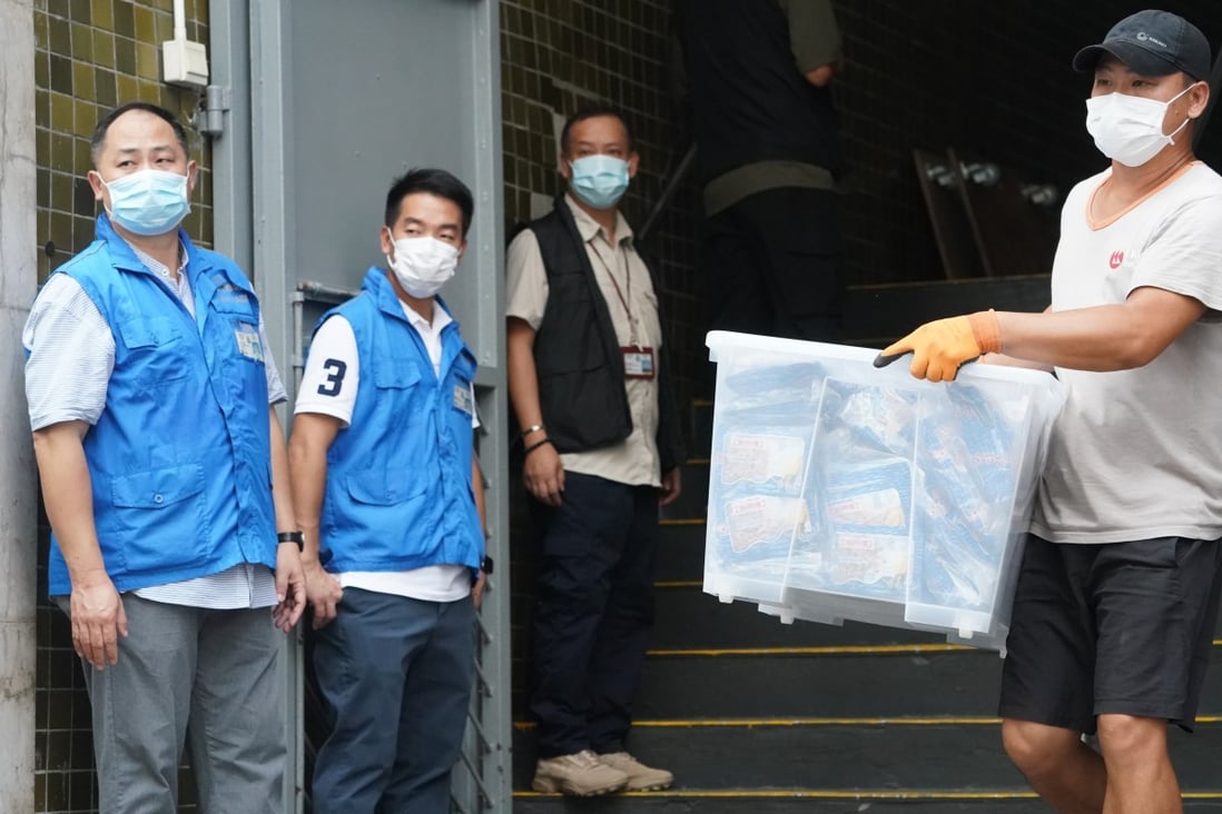 National security police search the group’s warehouse on Monday. Photo: Felix Wong
