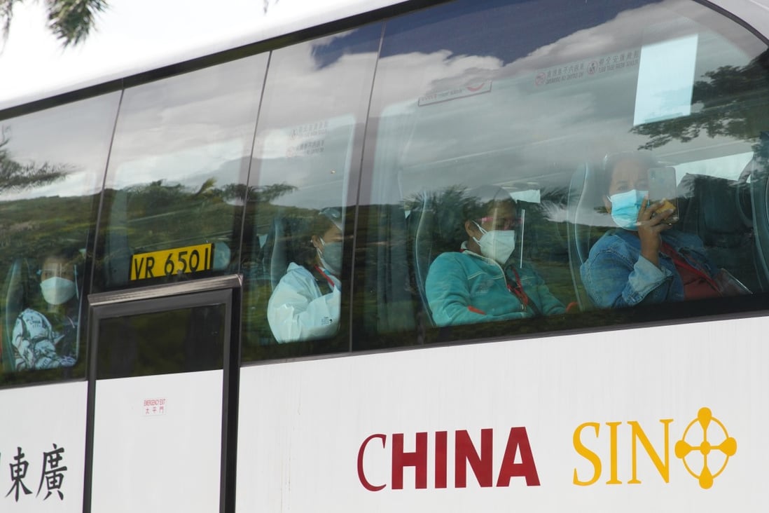 Domestic helpers arriving in Hong Kong are taken to their quarantine facility. Photo: Winson Wong
