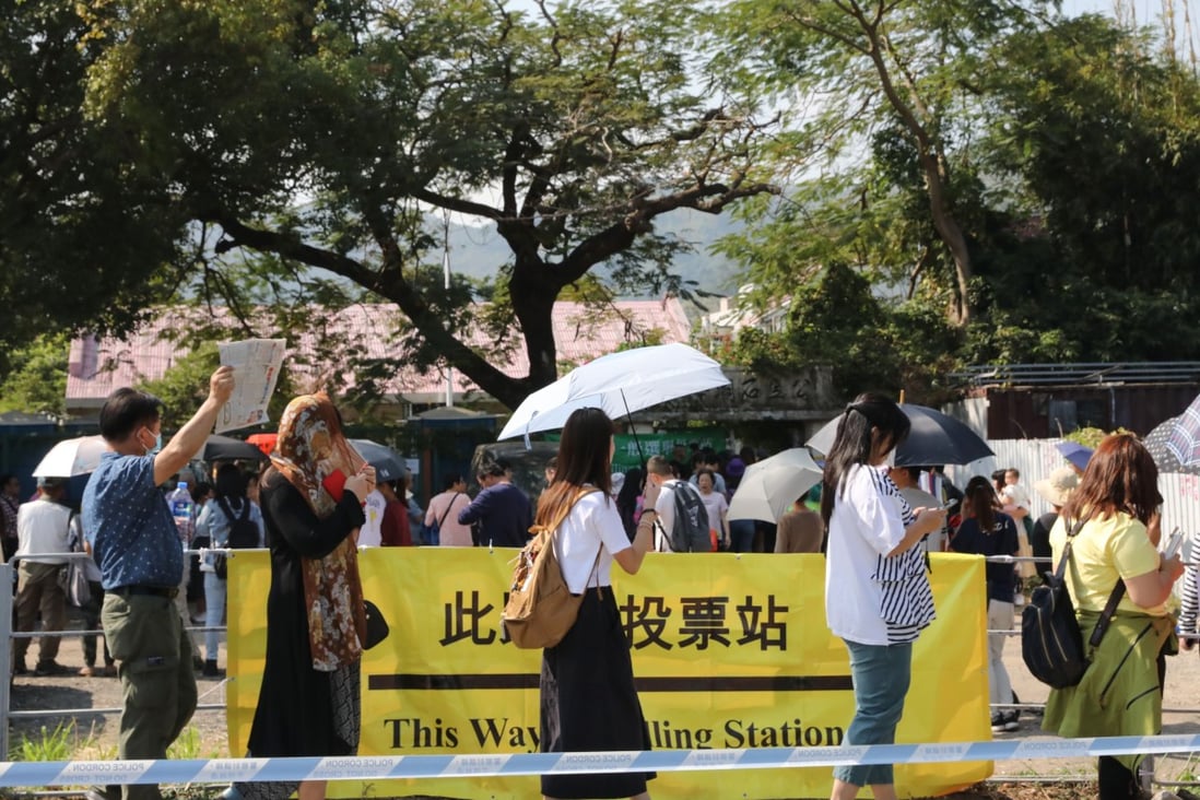Voters line up to cast ballots in the district council election in November 2019. Photo: K. Y. Cheng